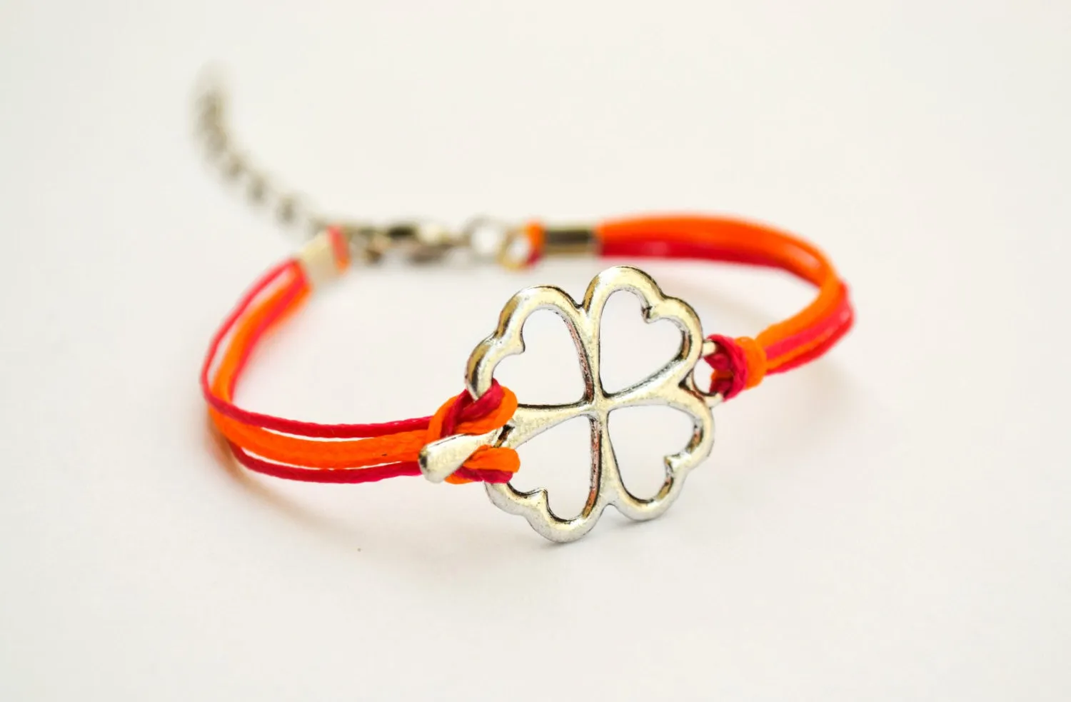 Clover bracelet, orange and pink cord bracelet with a silver shamrock charm, children's size