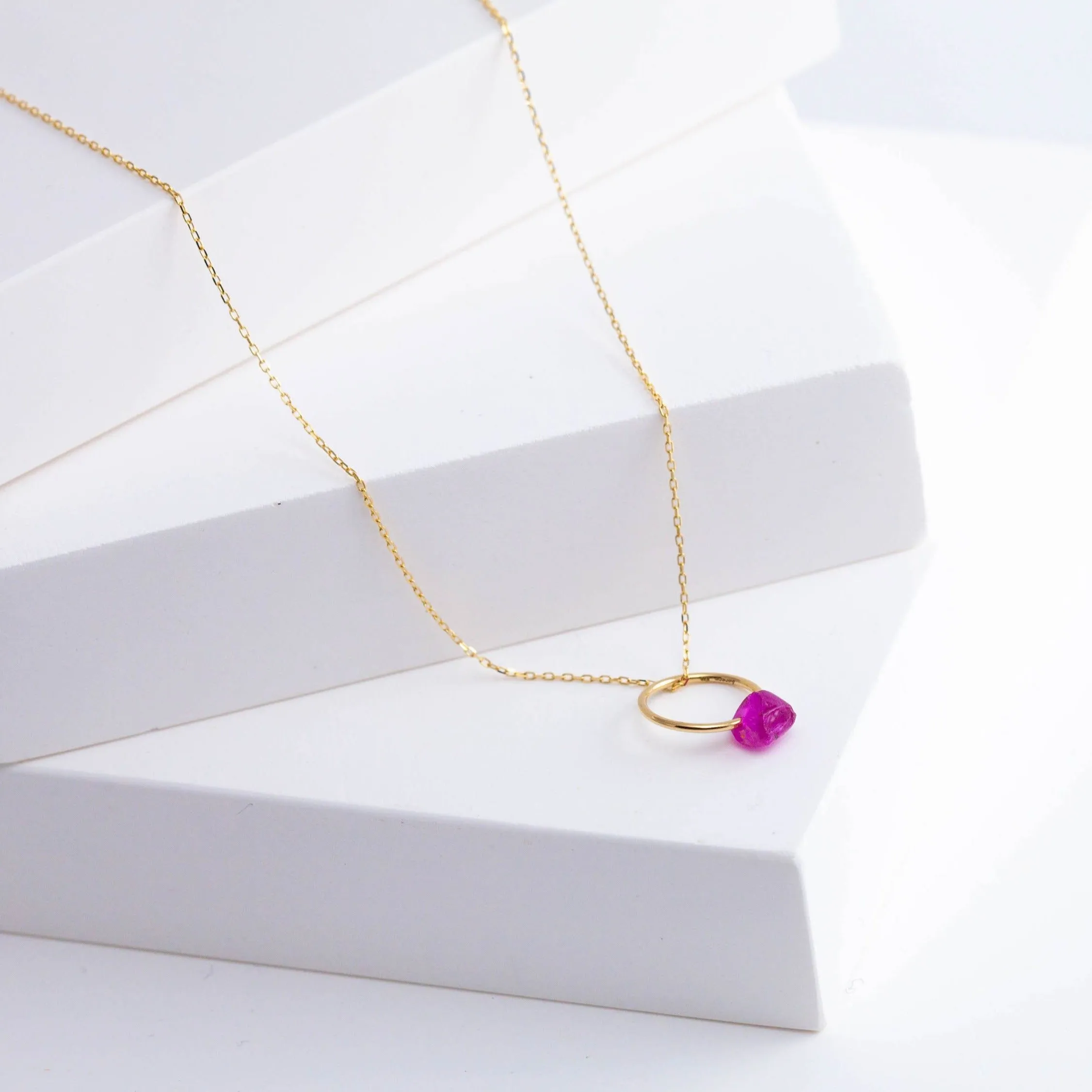 Rough stone ruby pendant