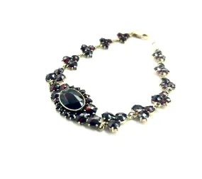 Royalty would love! 14k Yellow Gold and Oval Milange Garnet Bracelet