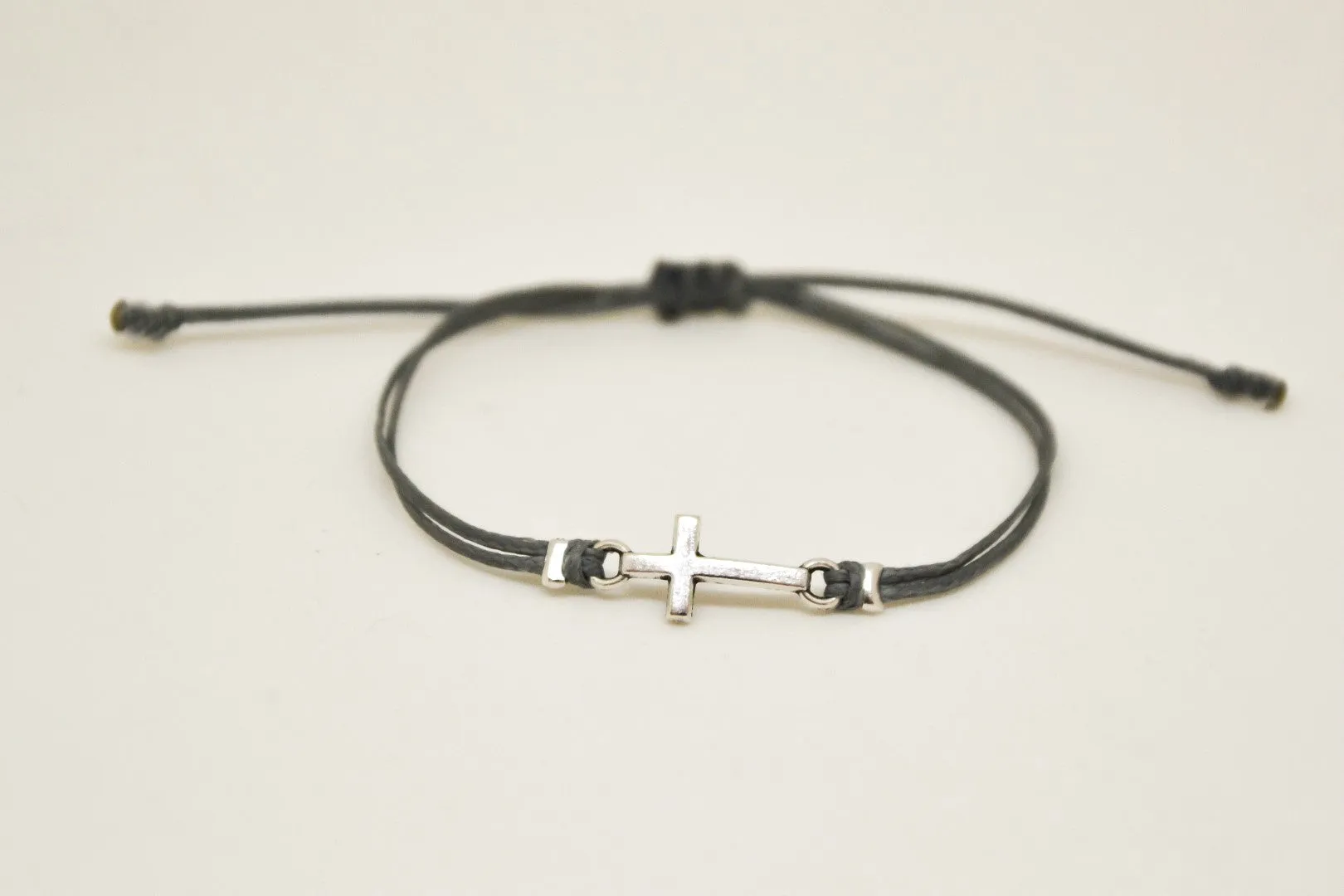 Silver cross charm bracelet, gray cord, adjustable sliding knot, custom color